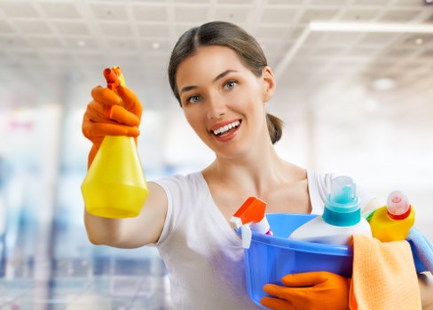 Cleaner preparing carpet cleaning equipment safely